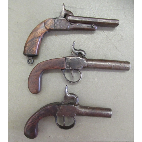 81 - Three early 19thC Percussion action muff pistols, one double barrelled with folding triggers and eng... 