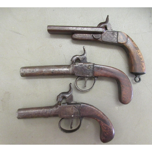 81 - Three early 19thC Percussion action muff pistols, one double barrelled with folding triggers and eng... 