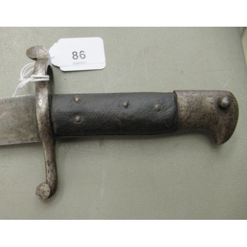 86 - A 19thC bayonet with a two part handgrip and a curved blade 23