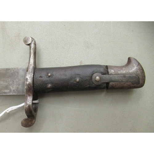 86 - A 19thC bayonet with a two part handgrip and a curved blade 23