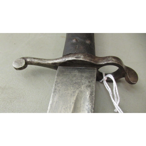 86 - A 19thC bayonet with a two part handgrip and a curved blade 23