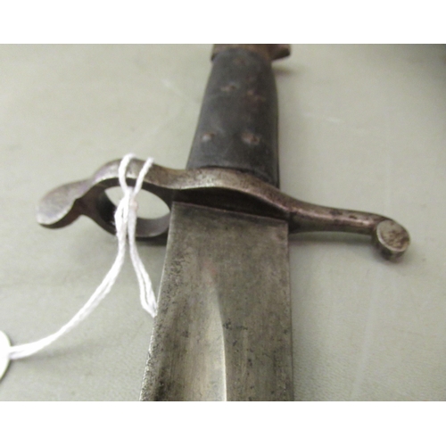 86 - A 19thC bayonet with a two part handgrip and a curved blade 23