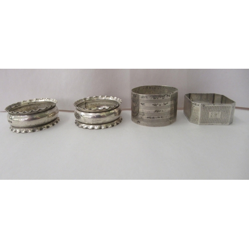 88 - Seven variously decorated silver napkin rings: to include a pair with crimped rims  mixed marks... 