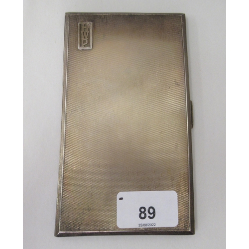 89 - A silver folding engine turned cigarette case with canted sides  Chester 1937