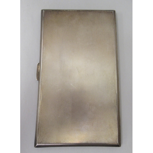 89 - A silver folding engine turned cigarette case with canted sides  Chester 1937