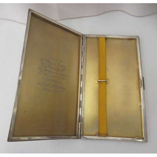 89 - A silver folding engine turned cigarette case with canted sides  Chester 1937