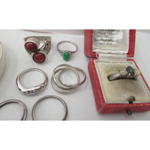 93 - Silver, silver coloured and white metal jewellery: to include dress rings; and four charm bracelets&... 