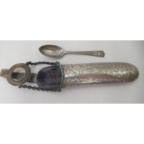 95 - Silver, viz. an engraved chatelaine clip and spectacles case; a postage stamp pendant, on a fine nec... 