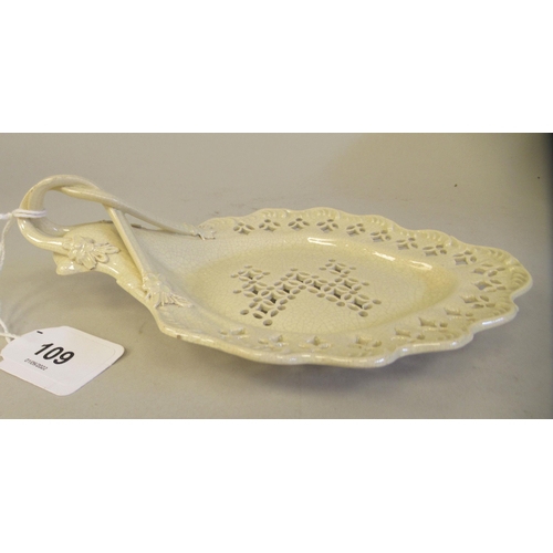 109 - A late 18thC creamware leaf dish with uniformly pierced ornament and an entwined handle  8.5