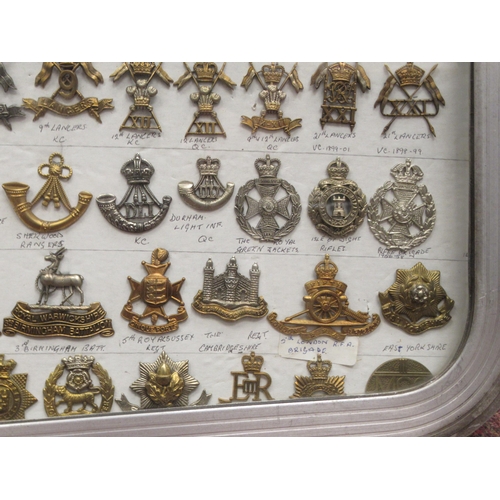 111 - Approx. one hundred military cap badges and other insignia, some copies: to include King's Own Royal... 