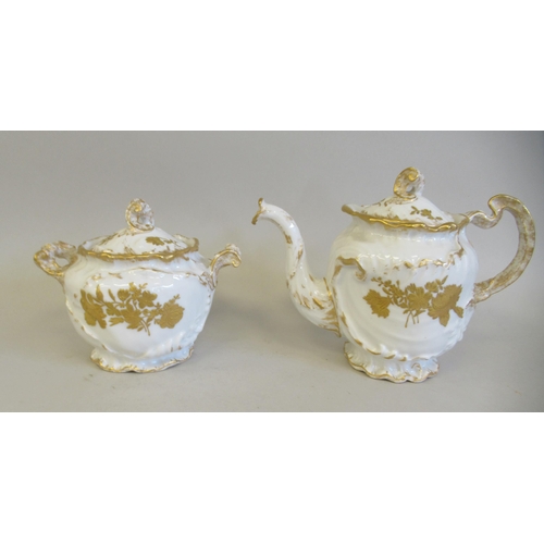 112 - A late 19thC Limoges ivory glazed and gilded porcelain cabaret set, decorated with floral sprigs&nbs... 