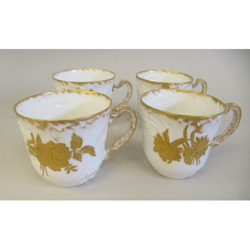 112 - A late 19thC Limoges ivory glazed and gilded porcelain cabaret set, decorated with floral sprigs&nbs... 