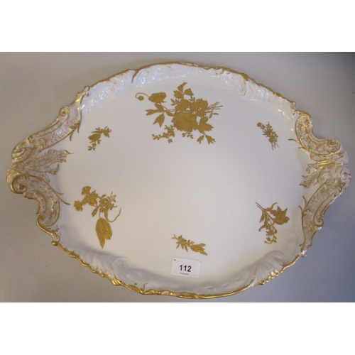 112 - A late 19thC Limoges ivory glazed and gilded porcelain cabaret set, decorated with floral sprigs&nbs... 