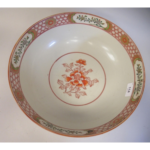 114 - A late 19thC Chinese porcelain footed bowl, decorated with flowering prunus, flora in reserves and h... 