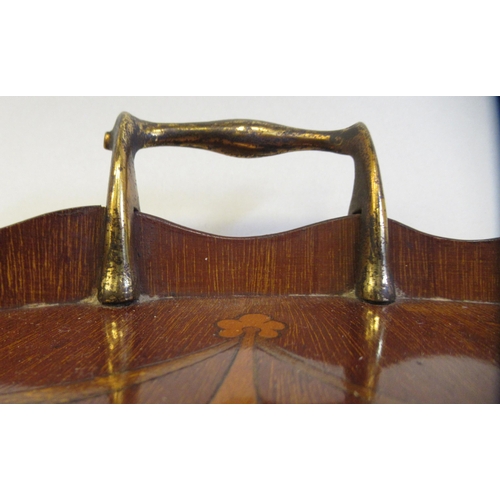 117 - A late 19thC galleried kidney shape serving tray with marquetry ornament and opposing brass handset ... 