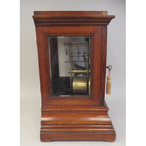 118 - A 19thC mahogany cased bracket timepiece with bevelled glass panels and visible escapement, on an og... 