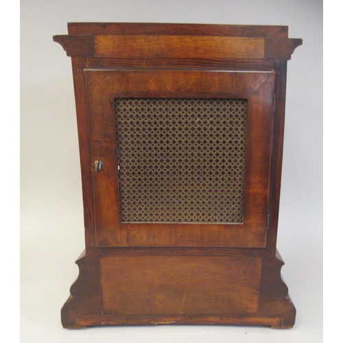 118 - A 19thC mahogany cased bracket timepiece with bevelled glass panels and visible escapement, on an og... 