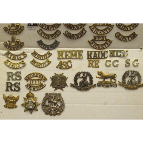 125 - A collection of various military cap badges, uniform titles and other insignia, some copies: to incl... 