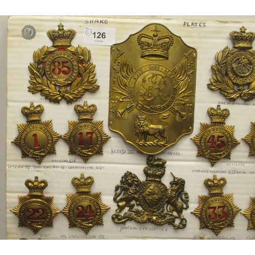 126 - Approx. twenty-five military Shako plates, some copies: to include East Riding Regt, George III Infa... 