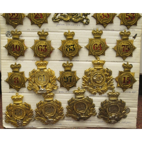 126 - Approx. twenty-five military Shako plates, some copies: to include East Riding Regt, George III Infa... 