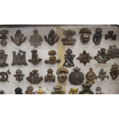 127 - Approx. one hundred military cap badges and other insignia, some copies: to include Marines Light In... 