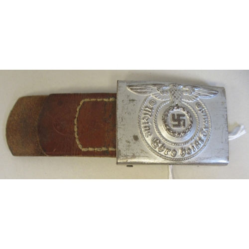 144 - A German SS military silvered belt buckle, on a section with an impressed 1940 mark   (Please Note: ... 