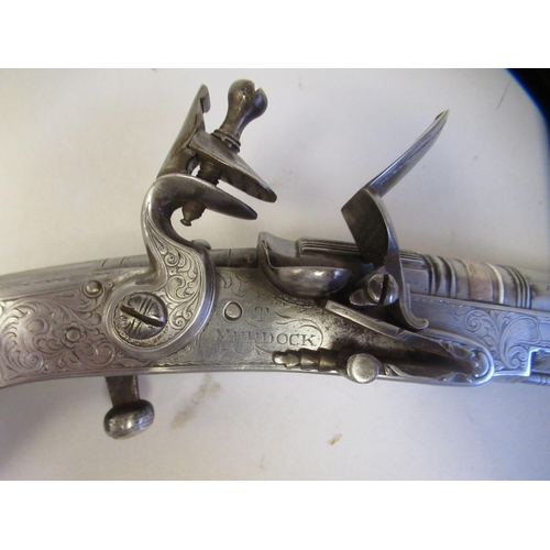 157 - A Scottish, all steel flintlock belt pistol, finely engraved with a Ram's horn butt, scrolls and oth... 