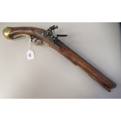 160 - A late 18thC design Tower flintlock pistol with a walnut stock, an applied brass butt, trigger guard... 