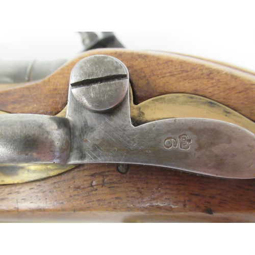 160 - A late 18thC design Tower flintlock pistol with a walnut stock, an applied brass butt, trigger guard... 