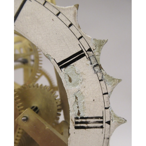 163 - A late 19thC Dent of London brass skeleton timepiece; the exposed single fusee movement faced by a p... 