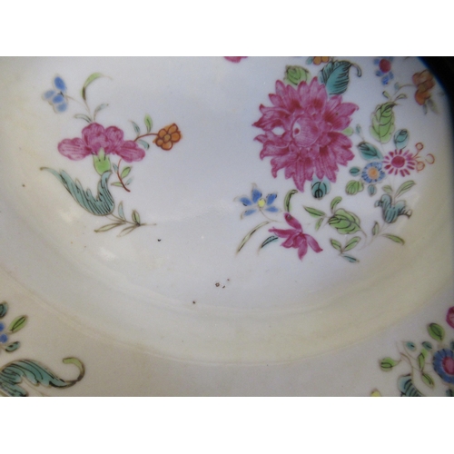 166 - A pair of late 18thC Chinese porcelain plates, decorated with floral sprigs  9.25