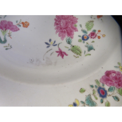 166 - A pair of late 18thC Chinese porcelain plates, decorated with floral sprigs  9.25