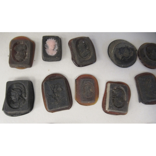 168 - A miscellaneous collection of moulded glass intaglios and seals