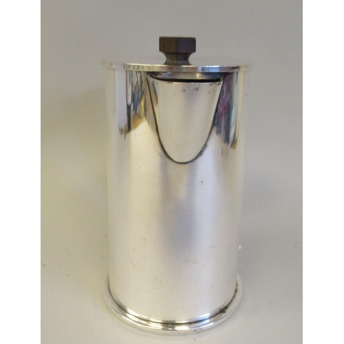 171 - An Art Deco inspired silver plated cylindrical hot water jug, reminiscent of trench art and fashione... 