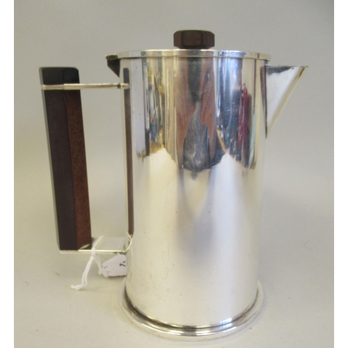 171 - An Art Deco inspired silver plated cylindrical hot water jug, reminiscent of trench art and fashione... 