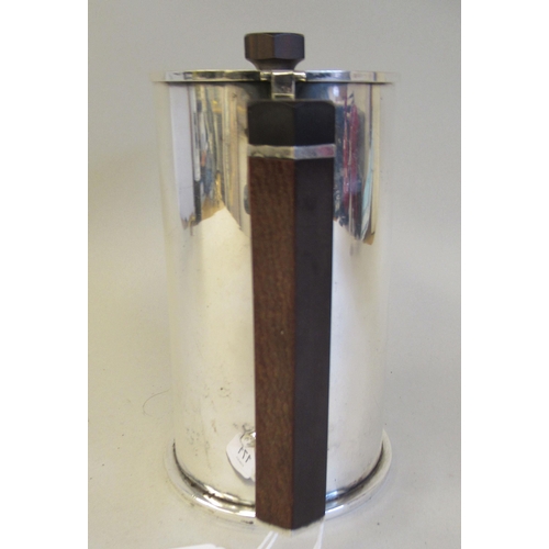 171 - An Art Deco inspired silver plated cylindrical hot water jug, reminiscent of trench art and fashione... 