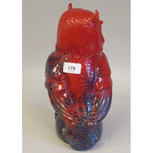 179 - A Royal Doulton flambe veined glazed china model, a standing owl  bears a printed mark & th... 