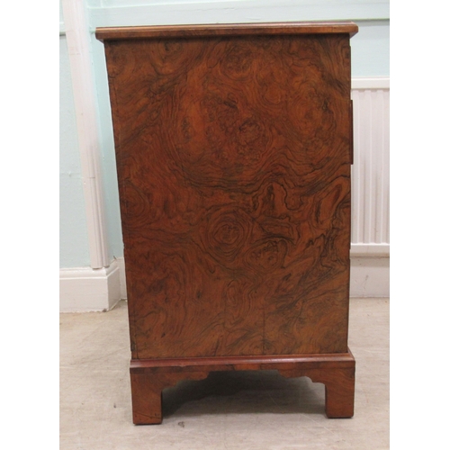 186 - A 19thC figured veneer walnut kneehole desk, over a shallow frieze drawer, flanked by six short draw... 