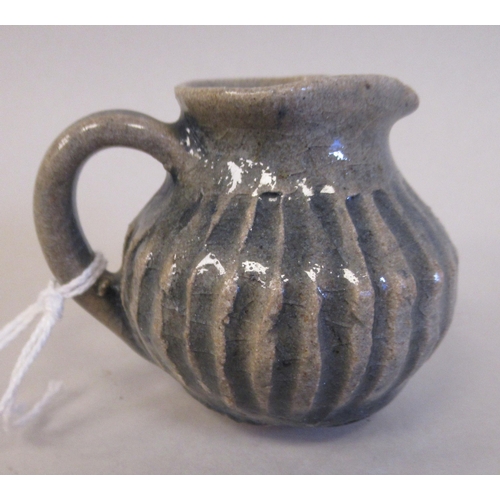 188 - A Katharine Pleydell-Bouverie miniature stoneware jug of reeded bulbous form  2