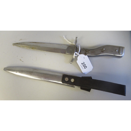 200 - A German Demag Duisberg all steel trench knife with a 'crank' handle and bayonet fittings, the blade... 