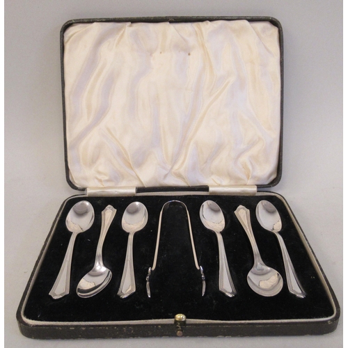 21 - A set of six silver teaspoons and a matching pair of claw type sugar tongs  Barker Bros  B... 