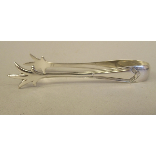 21 - A set of six silver teaspoons and a matching pair of claw type sugar tongs  Barker Bros  B... 