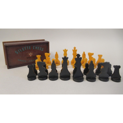 217 - A 1930s Grays of Cambridge Silette chess set, the catalin chessmen in black and 'marbled' yellow, th... 