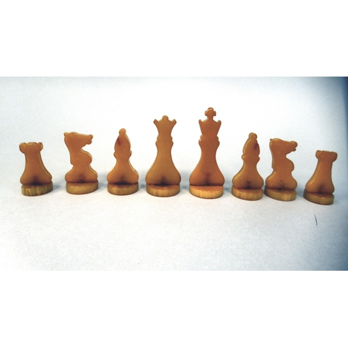 217 - A 1930s Grays of Cambridge Silette chess set, the catalin chessmen in black and 'marbled' yellow, th... 