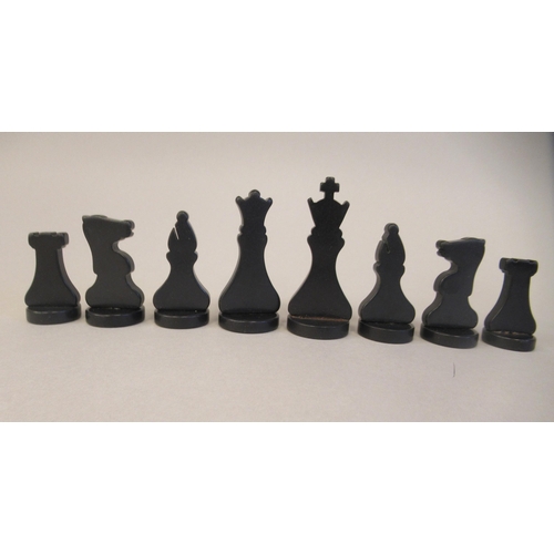 217 - A 1930s Grays of Cambridge Silette chess set, the catalin chessmen in black and 'marbled' yellow, th... 