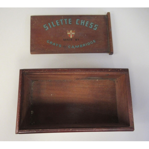 217 - A 1930s Grays of Cambridge Silette chess set, the catalin chessmen in black and 'marbled' yellow, th... 