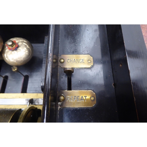 48 - A late 19thC Continental ebonised walnut and marquetry cased music box, the mechanical movement play... 