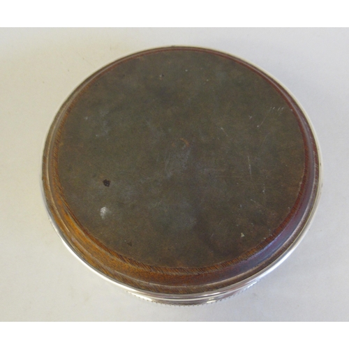 62 - A silver wine coaster with bead bordered, latticed sides, on a turned mahogany base  B&Co&n... 