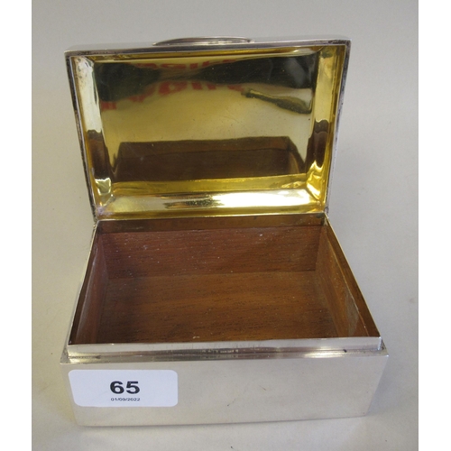 65 - A silver cigarette box with a cedar lining, straight sides and a chamfered, engine turned, hinged li... 