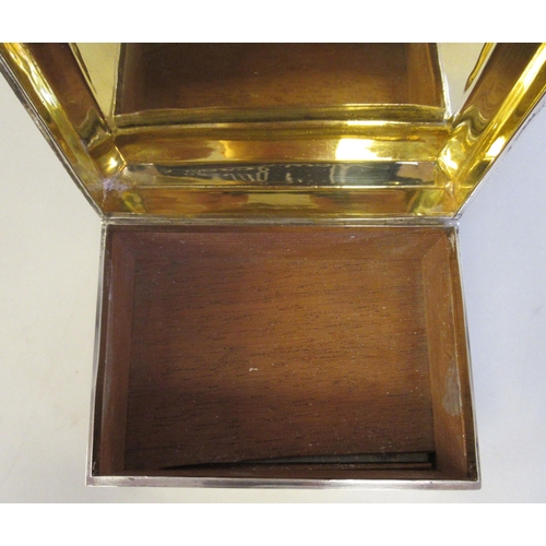 65 - A silver cigarette box with a cedar lining, straight sides and a chamfered, engine turned, hinged li... 